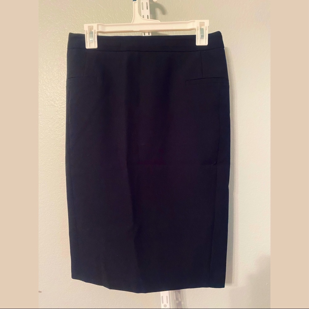 Plain black pencil skirt with rear zipper and small rear slit work wear